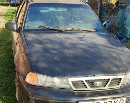 Чорний Деу Нексія, об'ємом двигуна 1.6 л та пробігом 304 тис. км за 713 $, фото 1 на Automoto.ua