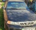 Чорний Деу Нексія, об'ємом двигуна 1.6 л та пробігом 304 тис. км за 713 $, фото 1 на Automoto.ua