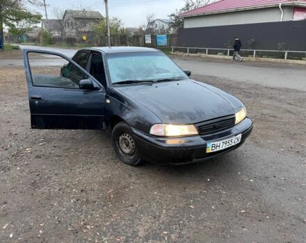 Чорний Деу Нексія, об'ємом двигуна 1.5 л та пробігом 150 тис. км за 1000 $, фото 5 на Automoto.ua