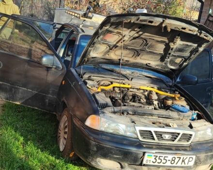 Чорний Деу Нексія, об'ємом двигуна 1.6 л та пробігом 304 тис. км за 713 $, фото 2 на Automoto.ua