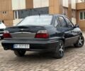 Черный Дэу Нексия, объемом двигателя 1.5 л и пробегом 210 тыс. км за 2450 $, фото 1 на Automoto.ua