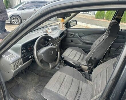 Черный Дэу Нексия, объемом двигателя 1.5 л и пробегом 213 тыс. км за 850 $, фото 3 на Automoto.ua