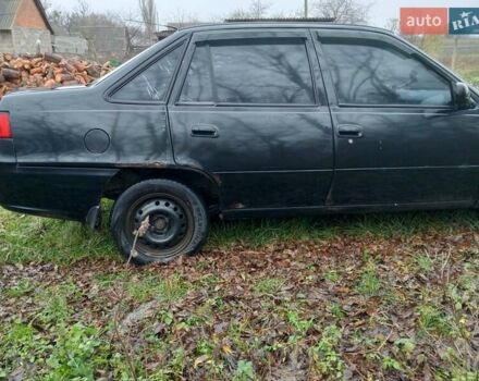 Чорний Деу Нексія, об'ємом двигуна 1.6 л та пробігом 378 тис. км за 1400 $, фото 3 на Automoto.ua