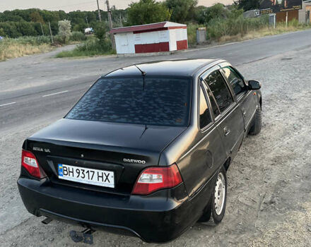 Черный Дэу Нексия, объемом двигателя 1.6 л и пробегом 177 тыс. км за 2500 $, фото 2 на Automoto.ua