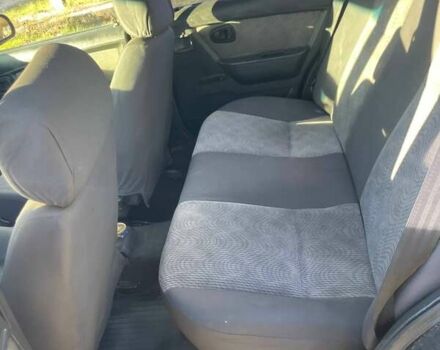 Деу Нексія 2011 у Змиеве на Automoto.ua Чорний Деу Нексія, об'ємом двигуна 1.5 л та пробігом 248 тис. км за 1100 $, фото 6 на Automoto.ua