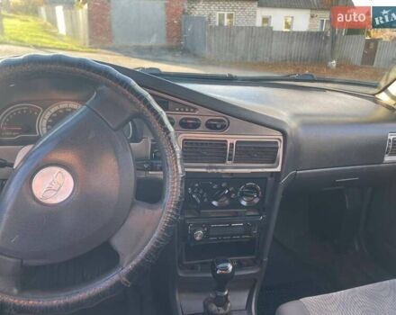 Деу Нексія 2011 у Змиеве на Automoto.ua Чорний Деу Нексія, об'ємом двигуна 1.5 л та пробігом 248 тис. км за 1100 $, фото 8 на Automoto.ua