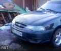 Черный Дэу Нексия, объемом двигателя 1.5 л и пробегом 200 тыс. км за 2400 $, фото 1 на Automoto.ua