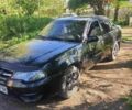 Черный Дэу Нексия, объемом двигателя 1.6 л и пробегом 210 тыс. км за 2700 $, фото 1 на Automoto.ua