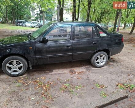 Черный Дэу Нексия, объемом двигателя 1.5 л и пробегом 208 тыс. км за 2500 $, фото 1 на Automoto.ua