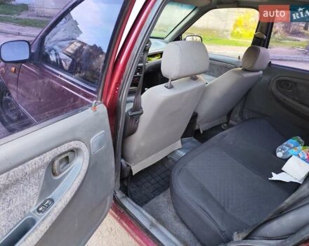 Червоний Деу Нексія, об'ємом двигуна 1.5 л та пробігом 182 тис. км за 1390 $, фото 11 на Automoto.ua