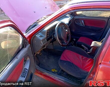 Красный Дэу Нексия, объемом двигателя 1.5 л и пробегом 302 тыс. км за 1000 $, фото 1 на Automoto.ua