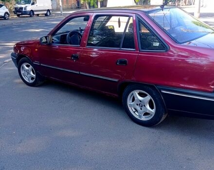 Красный Дэу Нексия, объемом двигателя 1.5 л и пробегом 213 тыс. км за 2000 $, фото 1 на Automoto.ua