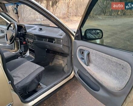 Жовтий Деу Нексія, об'ємом двигуна 1.5 л та пробігом 205 тис. км за 1399 $, фото 26 на Automoto.ua
