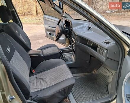 Жовтий Деу Нексія, об'ємом двигуна 1.5 л та пробігом 205 тис. км за 1399 $, фото 27 на Automoto.ua