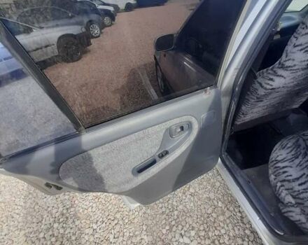 Сірий Деу Нексія, об'ємом двигуна 1.5 л та пробігом 250 тис. км за 1190 $, фото 7 на Automoto.ua