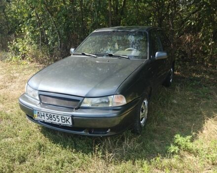 Сірий Деу Нексія, об'ємом двигуна 1.5 л та пробігом 395 тис. км за 1099 $, фото 1 на Automoto.ua