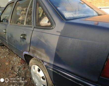 Синий Дэу Нексия, объемом двигателя 1.5 л и пробегом 234 тыс. км за 699 $, фото 1 на Automoto.ua