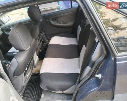 Синій Деу Нексія, об'ємом двигуна 1.5 л та пробігом 250 тис. км за 1301 $, фото 5 на Automoto.ua