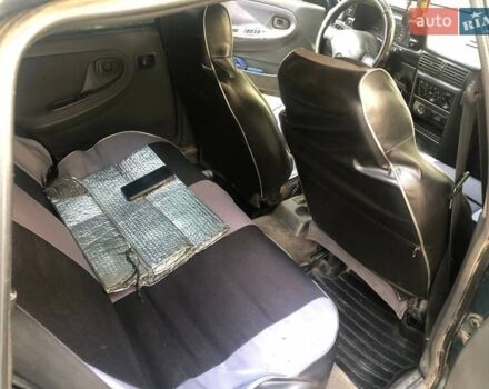 Зеленый Дэу Нексия, объемом двигателя 1.5 л и пробегом 252 тыс. км за 1300 $, фото 5 на Automoto.ua