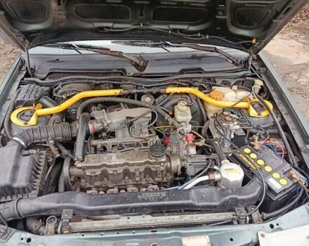 Зелений Деу Нексія, об'ємом двигуна 1.5 л та пробігом 330 тис. км за 1000 $, фото 8 на Automoto.ua