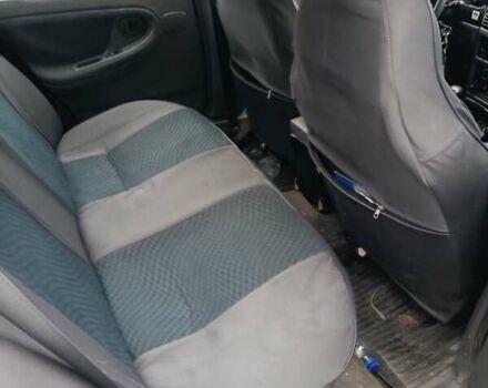 Зелений Деу Нексія, об'ємом двигуна 1.5 л та пробігом 330 тис. км за 1000 $, фото 2 на Automoto.ua