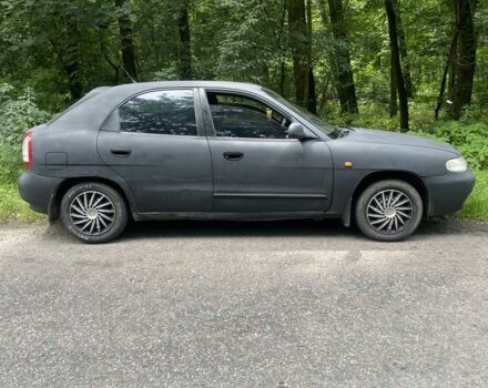 Черный Дэу Нубира, объемом двигателя 1.6 л и пробегом 235 тыс. км за 700 $, фото 1 на Automoto.ua