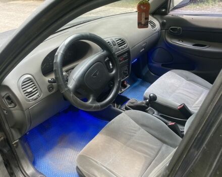 Черный Дэу Нубира, объемом двигателя 1.6 л и пробегом 235 тыс. км за 700 $, фото 2 на Automoto.ua