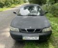Черный Дэу Нубира, объемом двигателя 1.6 л и пробегом 230 тыс. км за 900 $, фото 1 на Automoto.ua