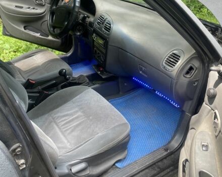 Черный Дэу Нубира, объемом двигателя 1.6 л и пробегом 235 тыс. км за 700 $, фото 3 на Automoto.ua