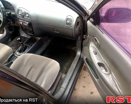 Чорний Деу Нубіра, об'ємом двигуна 1.6 л та пробігом 111 тис. км за 1111 $, фото 8 на Automoto.ua