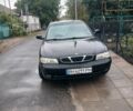 Черный Дэу Нубира, объемом двигателя 1.6 л и пробегом 300 тыс. км за 1000 $, фото 1 на Automoto.ua