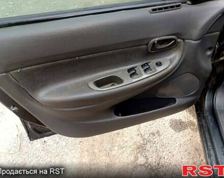 Чорний Деу Нубіра, об'ємом двигуна 1.6 л та пробігом 111 тис. км за 1111 $, фото 10 на Automoto.ua