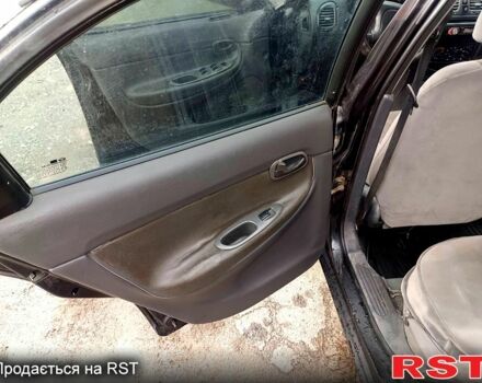 Чорний Деу Нубіра, об'ємом двигуна 1.6 л та пробігом 111 тис. км за 1111 $, фото 9 на Automoto.ua