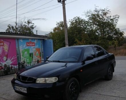 Черный Дэу Нубира, объемом двигателя 1.6 л и пробегом 300 тыс. км за 1000 $, фото 3 на Automoto.ua