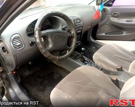 Чорний Деу Нубіра, об'ємом двигуна 1.6 л та пробігом 111 тис. км за 1111 $, фото 5 на Automoto.ua