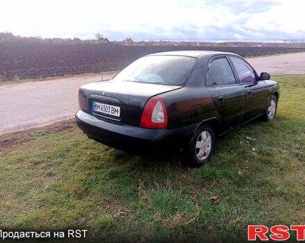 Чорний Деу Нубіра, об'ємом двигуна 1.6 л та пробігом 111 тис. км за 1111 $, фото 3 на Automoto.ua