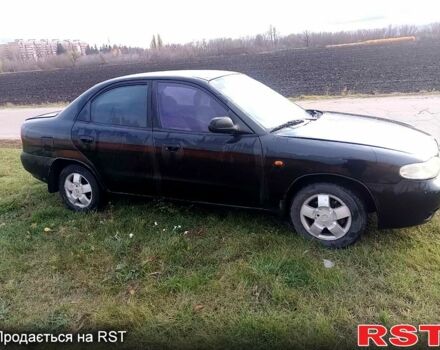 Чорний Деу Нубіра, об'ємом двигуна 1.6 л та пробігом 111 тис. км за 1111 $, фото 2 на Automoto.ua