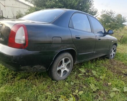 Черный Дэу Нубира, объемом двигателя 1.6 л и пробегом 250 тыс. км за 650 $, фото 1 на Automoto.ua