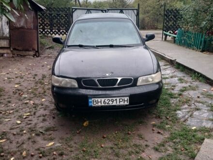 Чорний Деу Нубіра, об'ємом двигуна 1.6 л та пробігом 300 тис. км за 1000 $, фото 1 на Automoto.ua