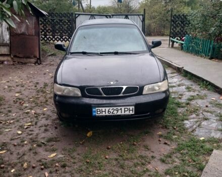 Черный Дэу Нубира, объемом двигателя 1.6 л и пробегом 300 тыс. км за 1000 $, фото 1 на Automoto.ua