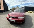 Красный Дэу Нубира, объемом двигателя 1.6 л и пробегом 160 тыс. км за 1900 $, фото 1 на Automoto.ua