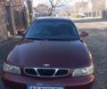 Красный Дэу Нубира, объемом двигателя 1.6 л и пробегом 250 тыс. км за 2100 $, фото 1 на Automoto.ua