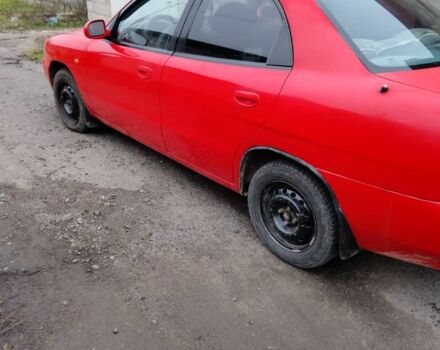 Червоний Деу Нубіра, об'ємом двигуна 1.6 л та пробігом 390 тис. км за 1939 $, фото 3 на Automoto.ua