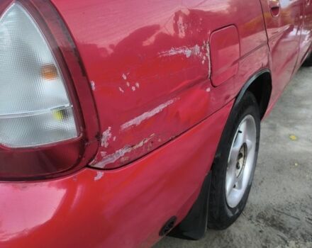 Красный Дэу Нубира, объемом двигателя 1.6 л и пробегом 330 тыс. км за 1100 $, фото 5 на Automoto.ua