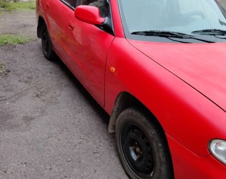 Червоний Деу Нубіра, об'ємом двигуна 1.6 л та пробігом 390 тис. км за 1939 $, фото 4 на Automoto.ua