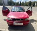 Красный Дэу Нубира, объемом двигателя 1.6 л и пробегом 300 тыс. км за 1814 $, фото 1 на Automoto.ua
