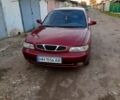 Красный Дэу Нубира, объемом двигателя 1.6 л и пробегом 580 тыс. км за 1100 $, фото 1 на Automoto.ua