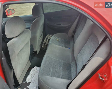 Красный Дэу Нубира, объемом двигателя 1.6 л и пробегом 300 тыс. км за 1400 $, фото 3 на Automoto.ua