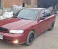 Красный Дэу Нубира, объемом двигателя 1.6 л и пробегом 200 тыс. км за 2655 $, фото 1 на Automoto.ua