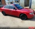 Красный Дэу Нубира, объемом двигателя 1.6 л и пробегом 229 тыс. км за 1800 $, фото 2 на Automoto.ua